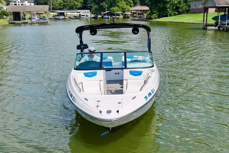 Slide: The Image of 2019 Chaparral 203 Vortex boat cruising on a serene lake. - 4