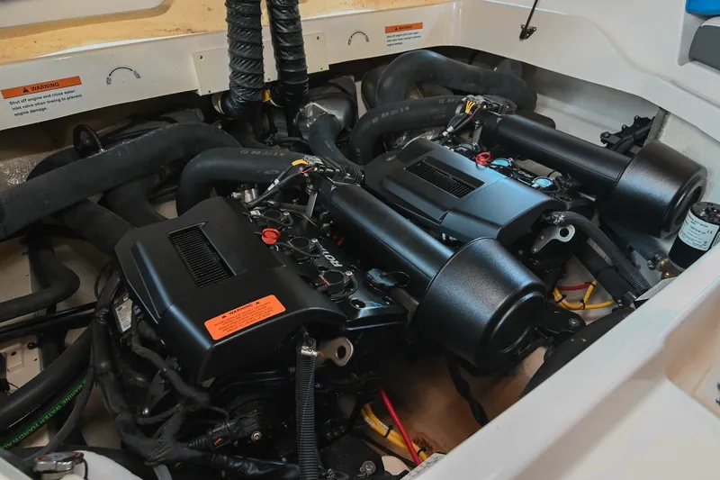 Slide: The Image of Engine compartment of 2019 Chaparral Vortex 2430 VRX boat, showcasing dual engines. - 49
