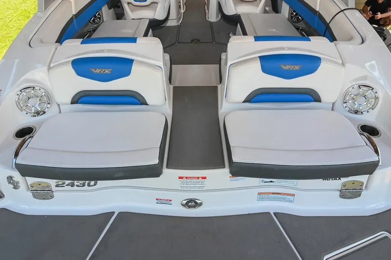 Slide: The Image of 2019 Chaparral Vortex 2430 VRX boat interior with blue and white seating. - 15