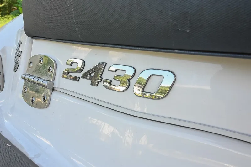 Slide: The Image of 2019 Chaparral Vortex 2430 VRX boat emblem and hinge detail. - 9