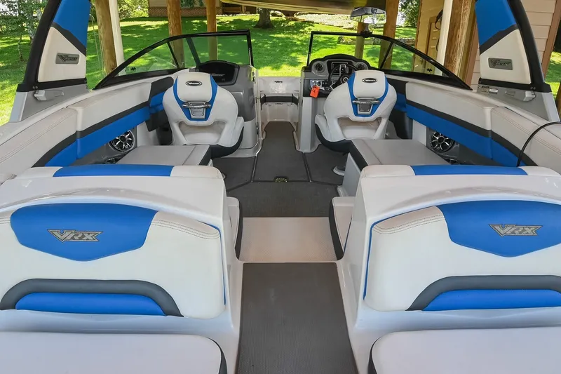 Slide: The Image of 2019 Chaparral Vortex 2430 VRX boat interior with blue and white seating. - 18