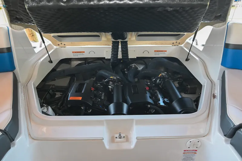 Slide: The Image of Engine compartment of a 2019 Chaparral Vortex 2430 VRX boat, showcasing dual engines. - 48