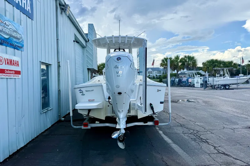 Slide: The Image of 2021 Regulator 26XO boat with Yamaha 425 V8 engine at a dealership. - 4