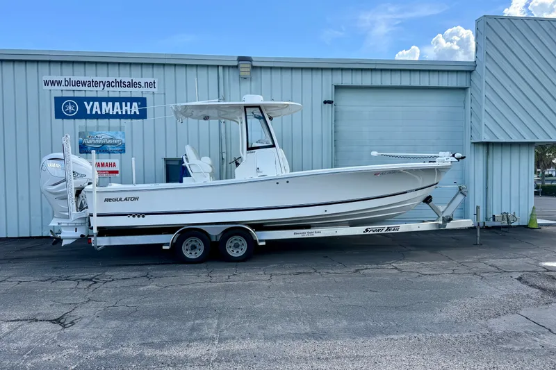The Image of 2021 Regulator 26XO boat on trailer at Bluewater Yacht Sales, featuring Yamaha engines. - 0
