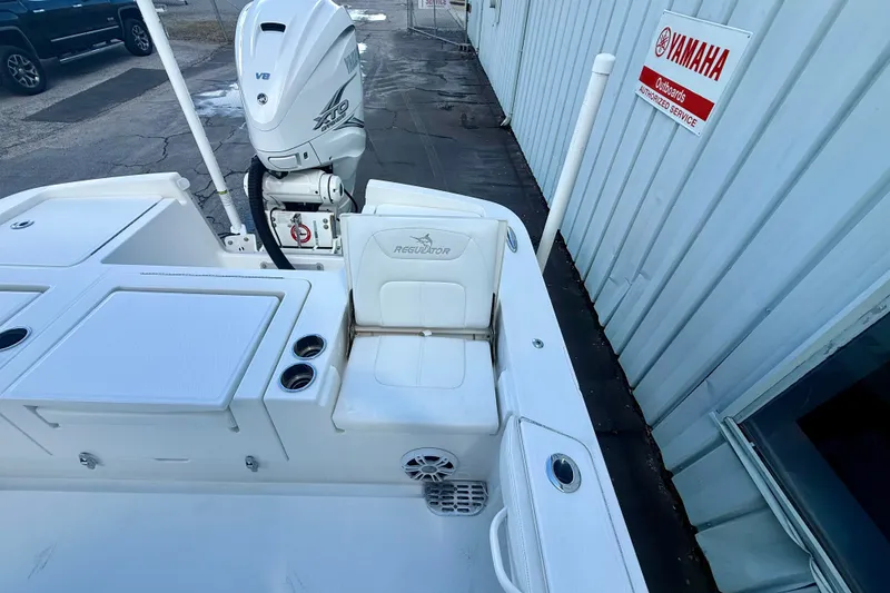 Slide: The Image of 2021 Regulator 26XO boat with Yamaha V8 engine at authorized service center. - 11