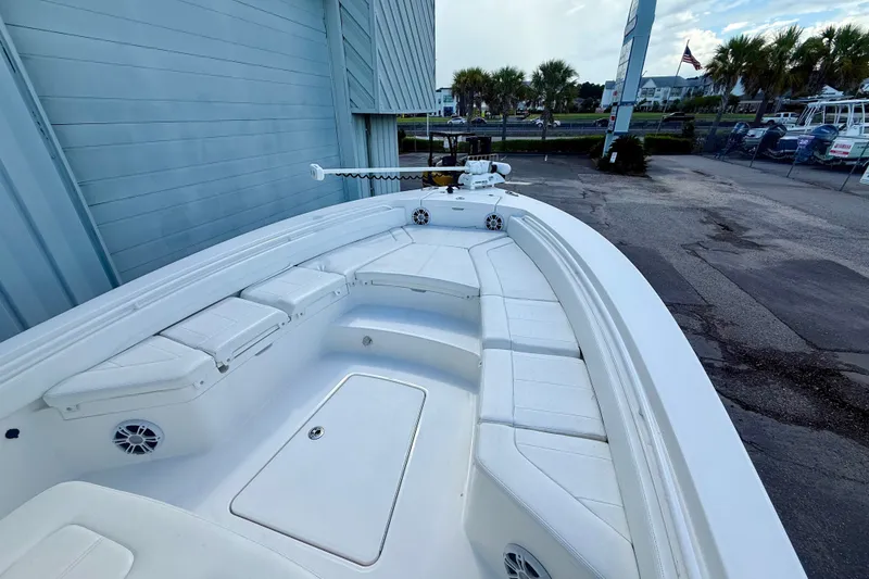 Slide: The Image of 2021 Regulator 26XO boat with spacious seating and sleek design. - 5