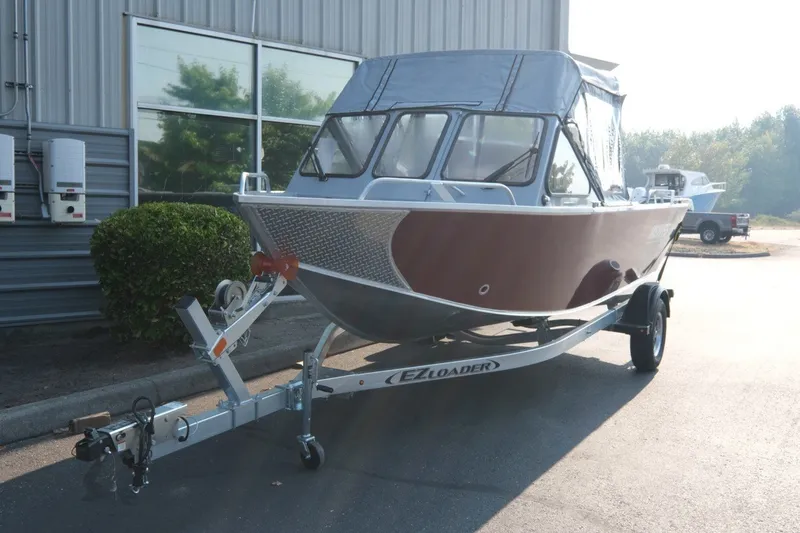 Slide: The Image of 2026 Hewescraft 180 Sportsman boat on trailer, parked outdoors. - 4