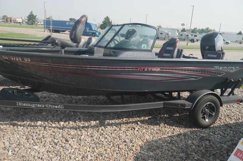 The Image of 2023 Ranger VS1782 WT fishing boat on trailer, parked on gravel. - 0