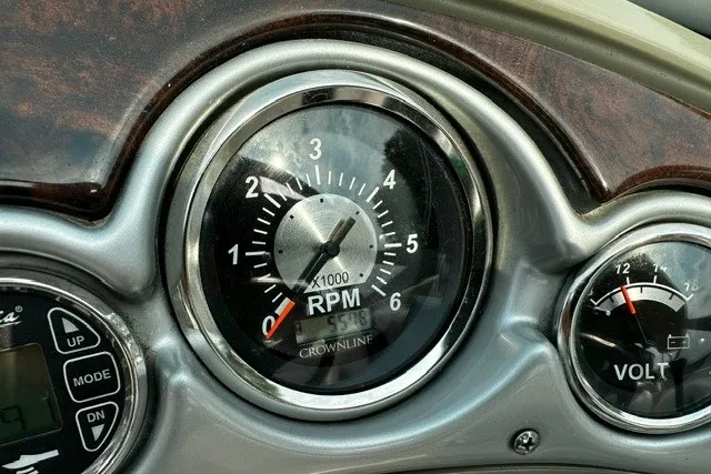 Slide: The Image of 2007 Crownline 260 LS dashboard with RPM and volt gauges. - 13