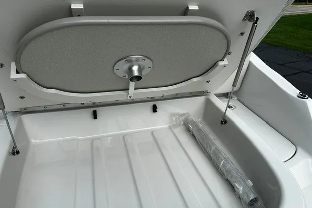 Slide: The Image of Open storage compartment of 2007 Crownline 260 LS boat, showcasing interior space. - 5