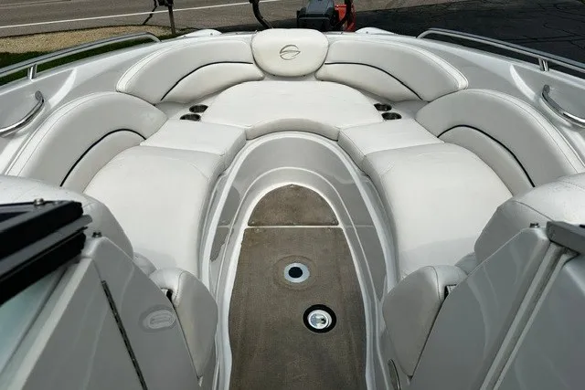 Slide: The Image of 2007 Crownline 260 LS boat interior with white cushioned seating. - 20