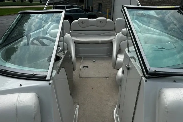 Slide: The Image of 2007 Crownline 260 LS boat interior with white seating and dual windshields. - 26