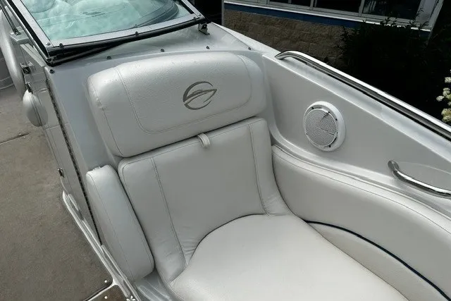 Slide: The Image of 2007 Crownline 260 LS boat interior with white leather seating and speaker. - 25