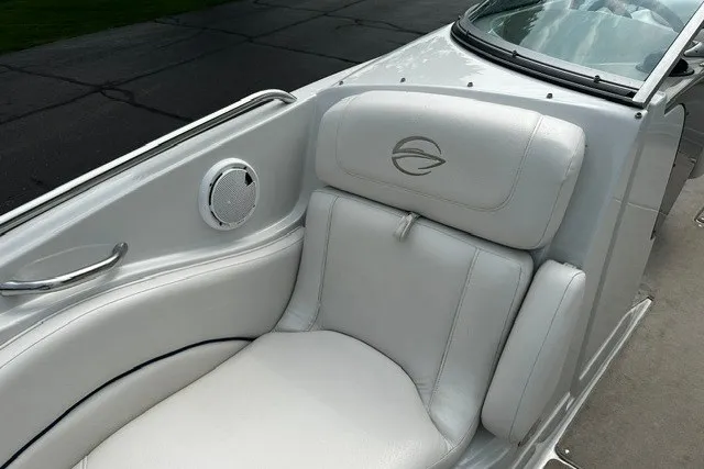 Slide: The Image of 2007 Crownline 260 LS boat interior with white leather seating and speaker detail. - 24
