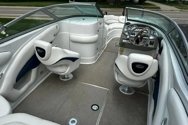 Slide: The Image of 2007 Crownline 260 LS boat interior with white seating and modern dashboard. - 8