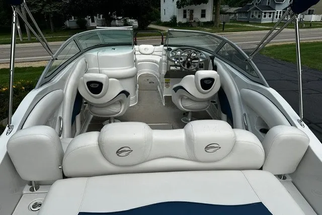 Slide: The Image of 2007 Crownline 260 LS boat interior with white seating and steering console. - 7