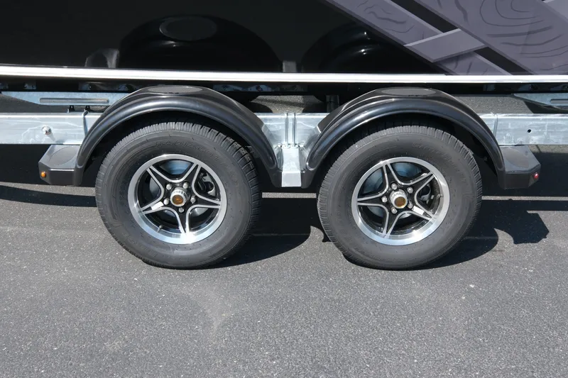 Slide: The Image of Trailer wheels of a 2026 Hewescraft 190 Sea Runner ET on asphalt. - 20
