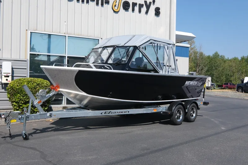 The Image of 2026 Hewescraft 190 Sea Runner ET boat on trailer outside dealership. - 2