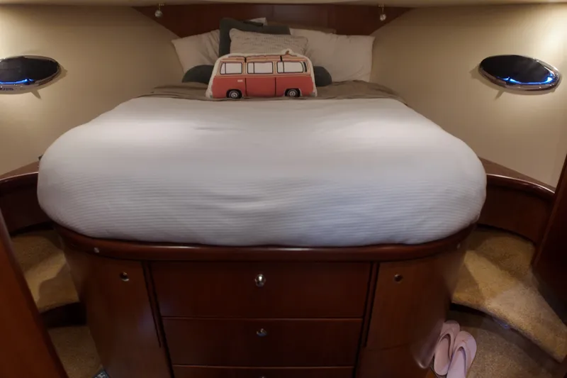 Slide: The Image of Cozy bedroom in 2007 Silverton 38 Convertible yacht with plush bedding and decorative pillow. - 19