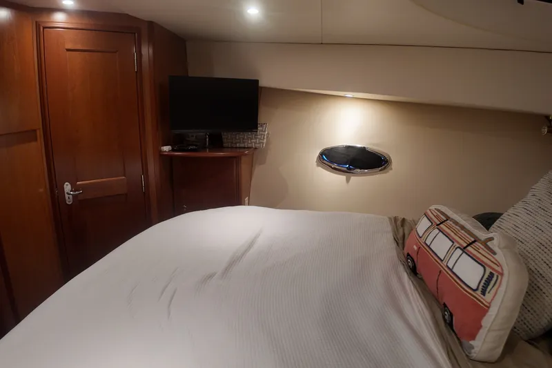 Slide: The Image of Cozy bedroom in 2007 Silverton 38 Convertible yacht with TV and decorative pillow. - 20