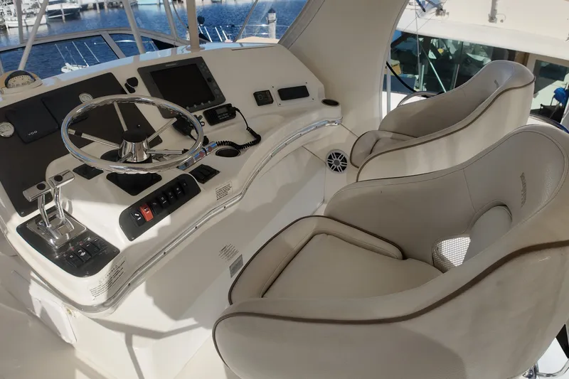 Slide: The Image of 2007 Silverton 38 Convertible helm with dual seats, steering wheel, and control panel. - 13