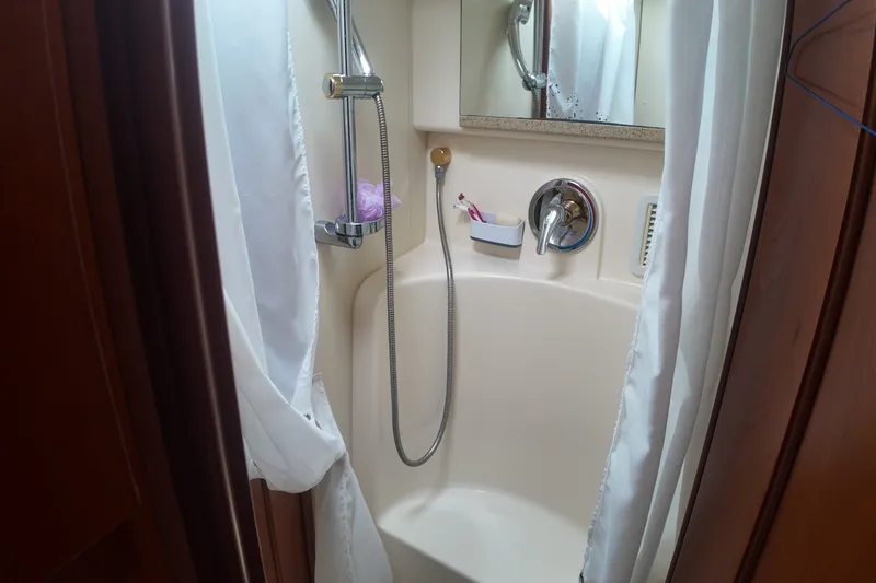 Slide: The Image of Shower area in 2007 Silverton 38 Convertible yacht with curtain and handheld showerhead. - 24