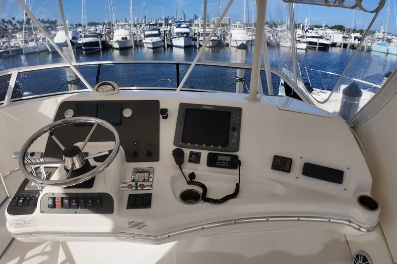 Slide: The Image of Helm of 2007 Silverton 38 Convertible yacht with steering wheel and navigation equipment. - 14