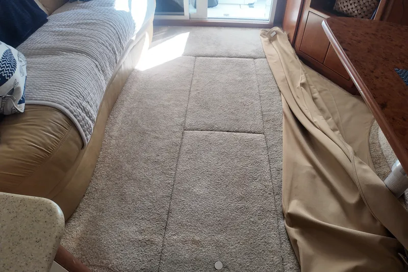 Slide: The Image of Interior of 2007 Silverton 38 Convertible with beige carpet and leather seating. - 18