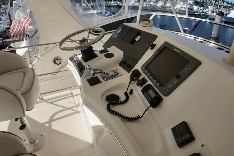 Slide: The Image of 2007 Silverton 38 Convertible yacht helm with navigation equipment and steering wheel. - 15
