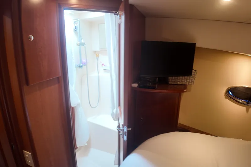 Slide: The Image of Interior of 2007 Silverton 38 Convertible yacht with bathroom and TV. - 22