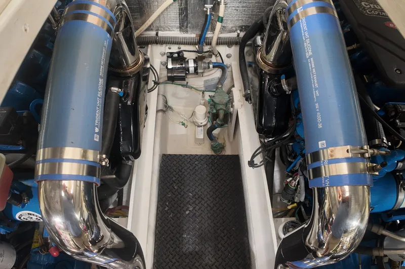 Slide: The Image of Engine room of a 2007 Silverton 38 Convertible with visible blue silicone hoses. - 27