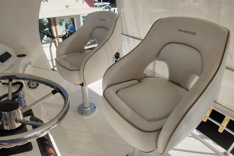 Slide: The Image of Captain's chairs and helm on 2007 Silverton 38 Convertible yacht. - 16