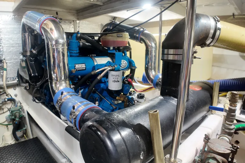 Slide: The Image of Engine room of a 2007 Silverton 38 Convertible boat, showcasing a powerful engine. - 28