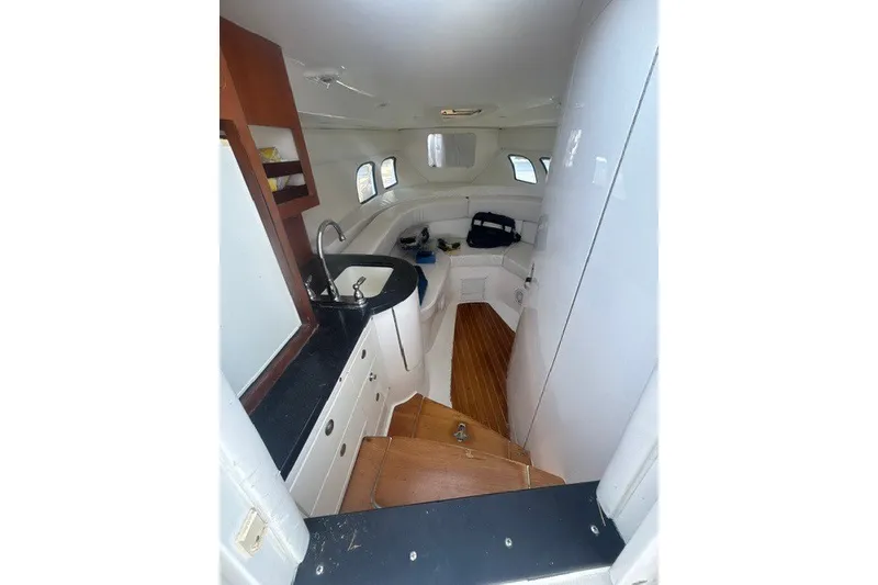 Slide: The Image of Interior of 2010 Intrepid 370 Cuddy boat with kitchenette and seating area. - 14