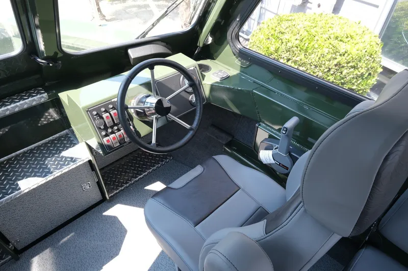 Slide: The Image of Interior of 2022 Hewescraft 190 Sea Runner ET Hardtop, featuring steering wheel and controls. - 12