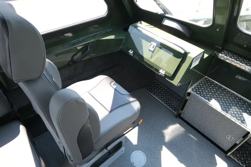 Slide: The Image of Interior of 2022 Hewescraft 190 Sea Runner ET Hardtop, featuring seating and storage compartments. - 14