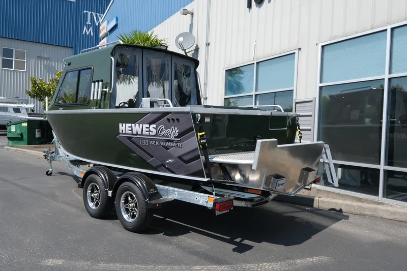 Slide: The Image of 2022 Hewescraft 190 Sea Runner ET Hardtop boat on trailer outside dealership. - 4