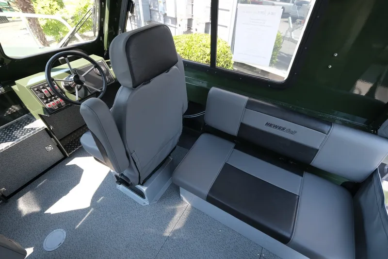 Slide: The Image of 2022 Hewescraft 190 Sea Runner ET Hardtop interior with steering wheel and seating. - 11