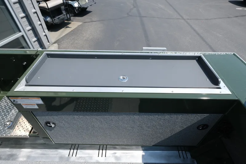 Slide: The Image of 2022 Hewescraft 190 Sea Runner ET Hardtop storage compartment on a sunny day. - 18