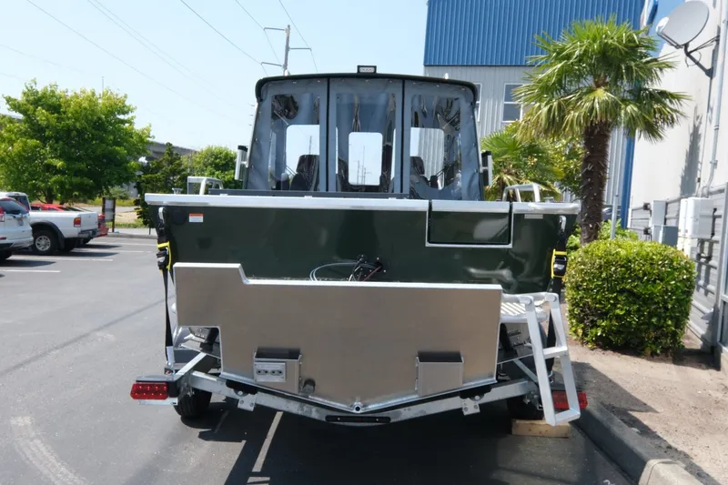 Slide: The Image of 2022 Hewescraft 190 Sea Runner ET Hardtop boat parked outdoors, rear view. - 5