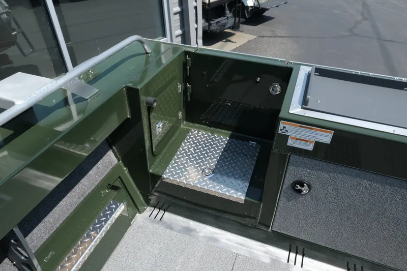 Slide: The Image of Interior view of 2022 Hewescraft 190 Sea Runner ET Hardtop boat, featuring storage compartments. - 8