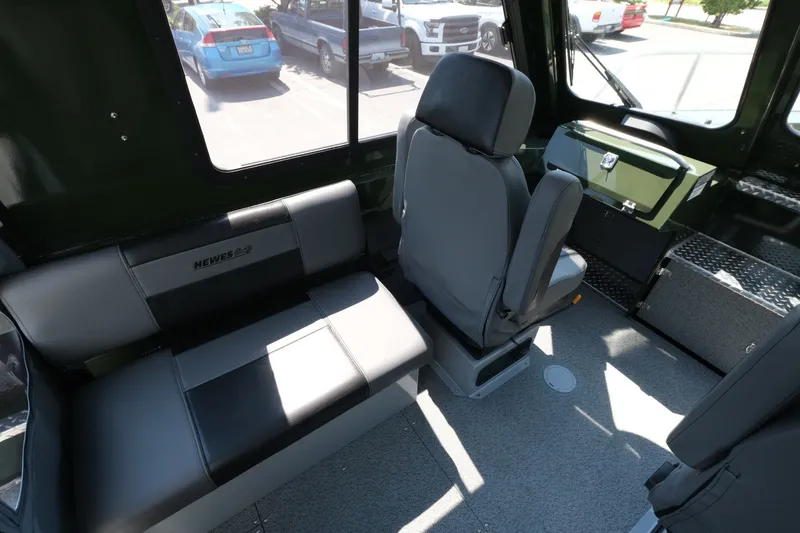 Slide: The Image of Interior of 2022 Hewescraft 190 Sea Runner ET Hardtop, featuring seating and dashboard. - 10