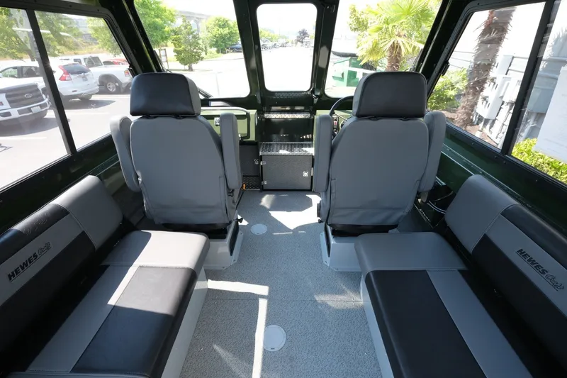 Slide: The Image of Interior of 2022 Hewescraft 190 Sea Runner ET Hardtop, featuring spacious seating and modern design. - 9