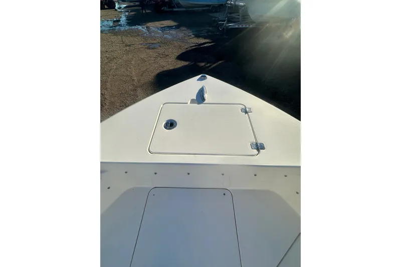 Slide: The Image of Bow view of 2021 Cobia 220 Center Console boat in sunlight. - 15