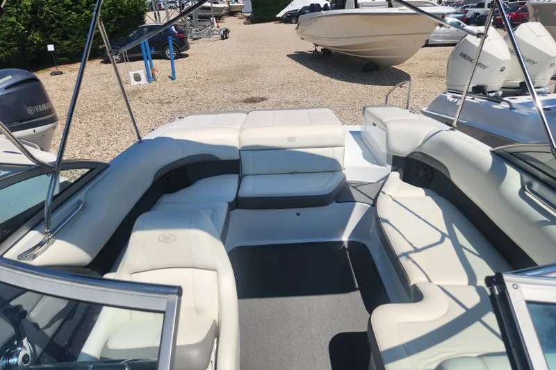 Slide: The Image of 2012 Cobalt 220 boat interior with spacious seating and modern design. - 3
