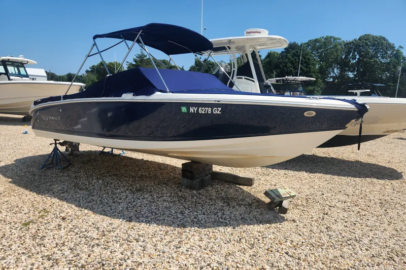 The Image of 2012 Cobalt 220 boat with blue cover on gravel lot, sunny day. - 0