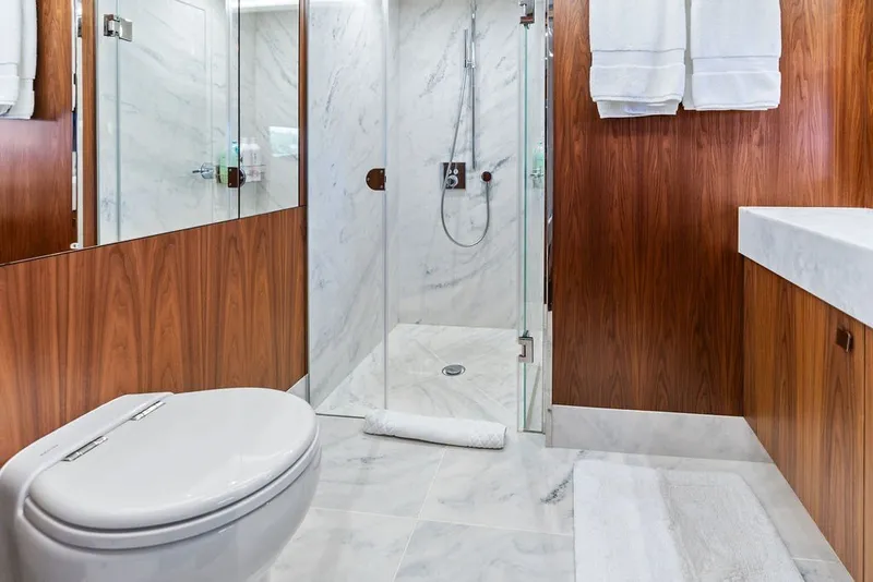 Slide: The Image of Luxurious bathroom on 2019 Sunseeker 86 Yacht with marble and wood finishes. - 102