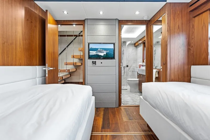 Slide: The Image of Luxurious interior of 2019 Sunseeker 86 Yacht with twin beds and modern bathroom. - 92
