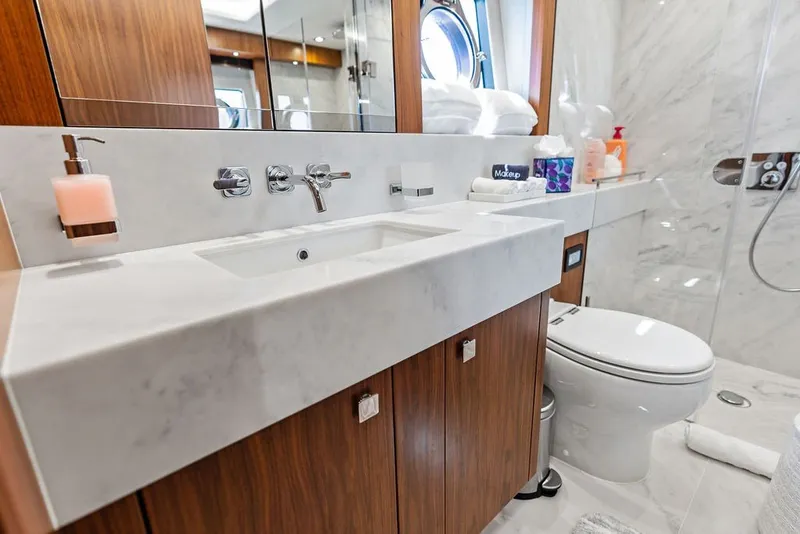 Slide: The Image of Luxurious bathroom in 2019 Sunseeker 86 Yacht with marble sink and modern fixtures. - 87