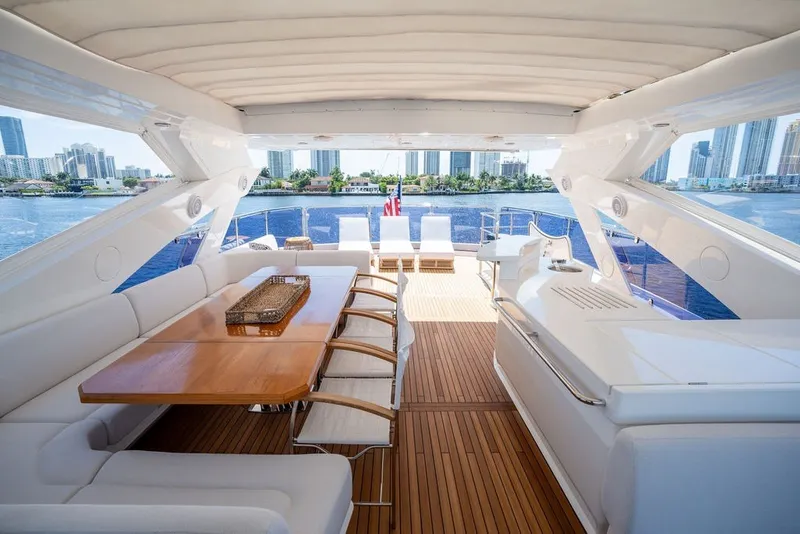 Slide: The Image of Luxurious 2019 Sunseeker 86 Yacht interior with elegant seating and scenic waterfront view. - 42